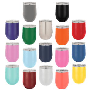 A group of different colored cups on a green background