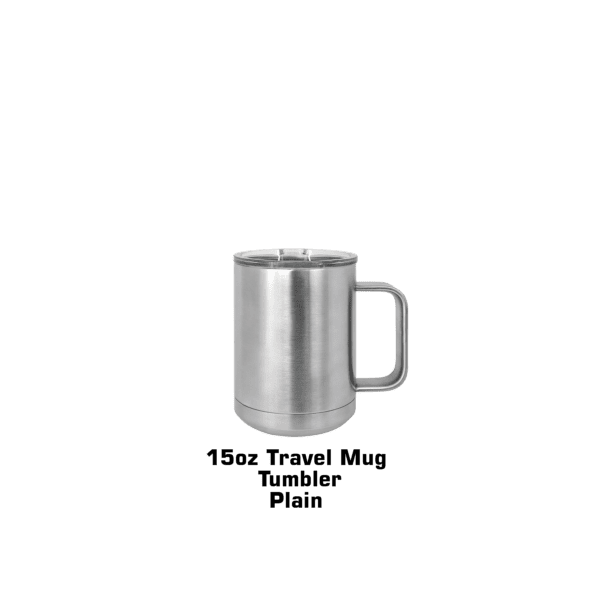 A silver mug sitting on top of a green table.