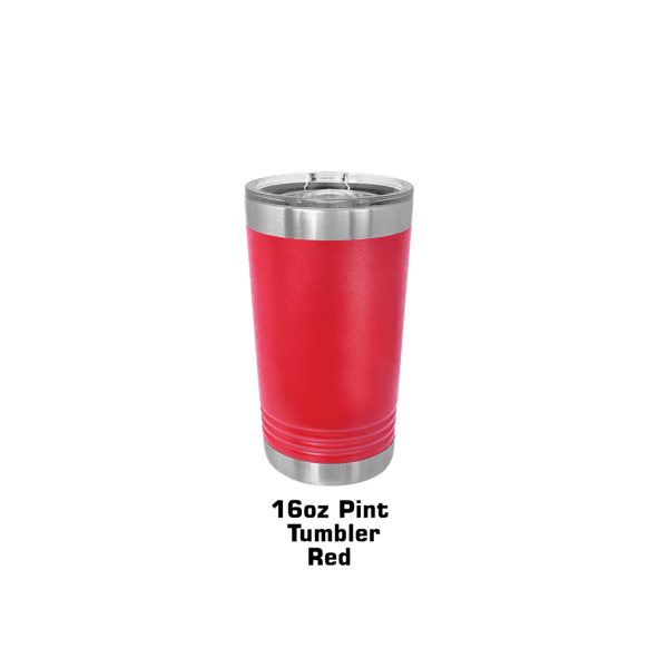 A red cup is sitting on the ground.