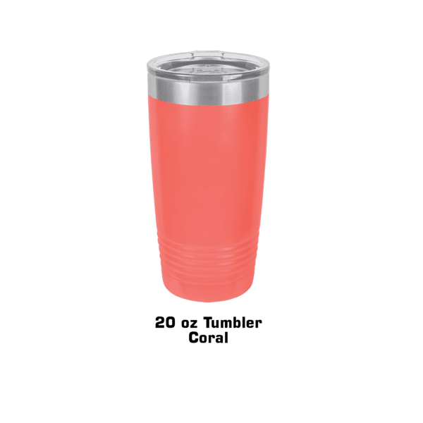 A pink cup is sitting on the ground.