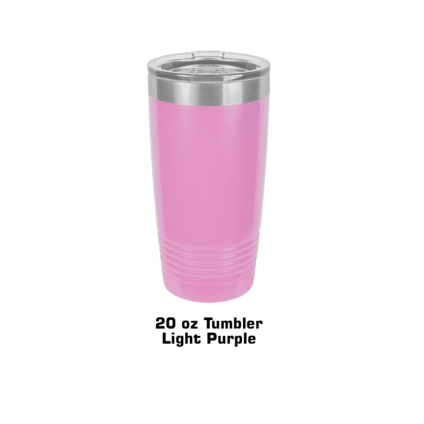 A pink cup is sitting on the ground.