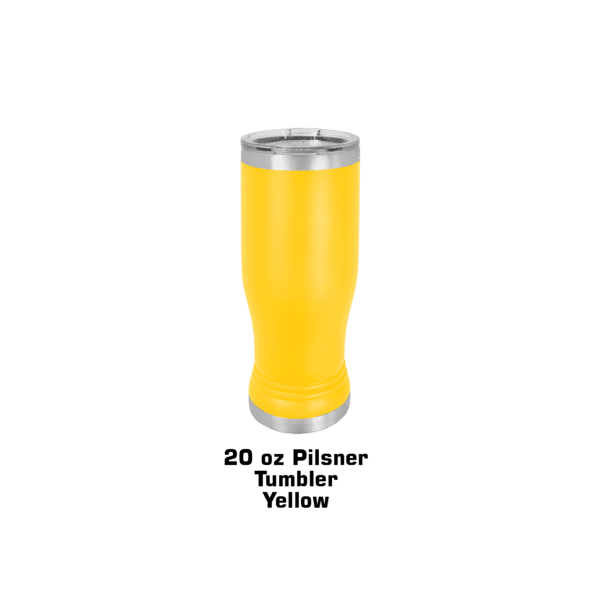 A yellow cup of beer is sitting on the ground.