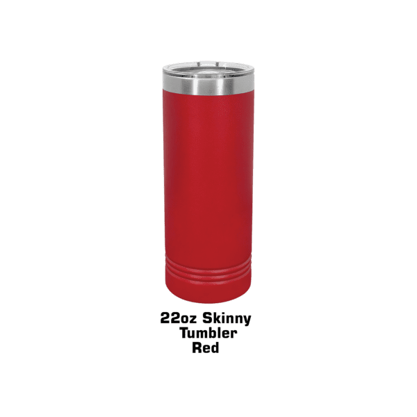 A red can sitting on top of a green table.