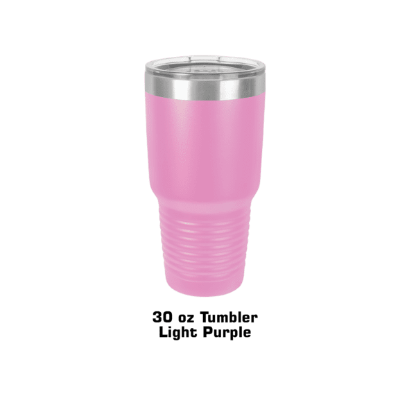 A pink cup is sitting on the ground.