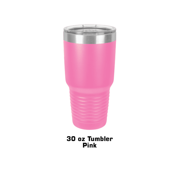 A pink cup is sitting on the ground.