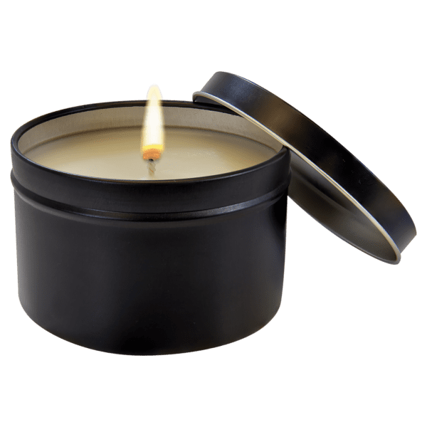 A candle in a tin container with a lid.