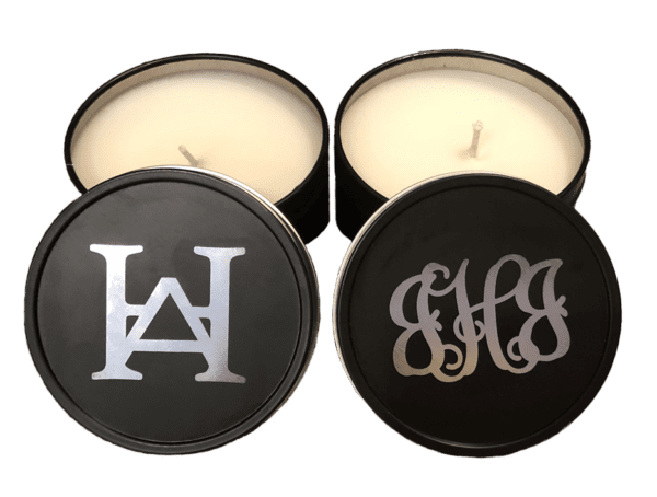 A couple of candles with the letters h and g on them.